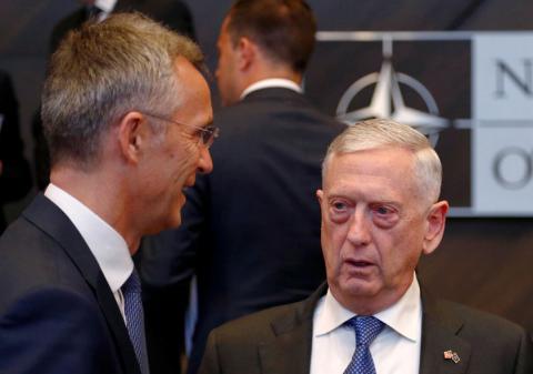NATO Secretary-General Jens Stoltenberg talks with U.S. Secretary of Defense Jim Mattis during a NATO defence ministers meeting at the Alliance headquarters in Brussels, Belgium, October 4, 2018. PHOTO BY REUTERS/Francois Lenoir