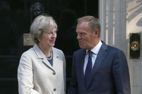 Britain's Prime Minister Theresa May (L) greets European Council President Donald Tusk in Downing Street in London, Britain, September 8, 2016. PHOTO BY REUTERS/Neil Hal