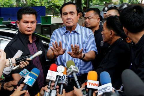 Thai Prime Minister Prayuth Chan-ocha talks to media at a polling station during a constitutional referendum vote in Bangkok, Thailand, August 7, 2016. PHOTO BY REUTERS/Jorge Silva