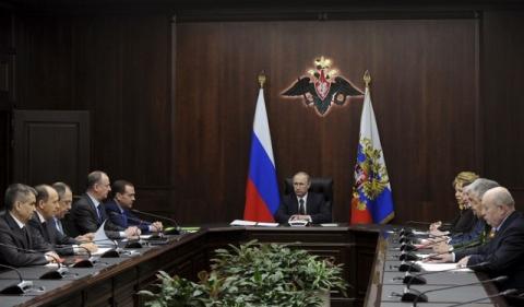 Russian President Vladimir Putin chairs a meeting with members of the Security Council at the National defence control centre in Moscow, Russia, March 11, 2016. PHOTO BY REUTERS/Mikhail Klimentyev