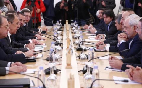 Foreign ministers, Sergei Lavrov (2nd L) of Russia, Mevlut Cavusoglu (3rd R) of Turkey, Mohammad Javad Zarif (2nd R) of Iran, and members of the delegations attend a meeting in Moscow, Russia, December 20, 2016. PHOTO BY REUTERS/Maxim Shemetov