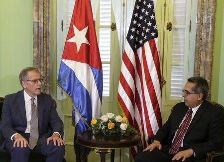 Chief of Mission at the U.S. Interests Section in Havana Jeffrey DeLaurentis (L) talks to Cuba's interim Foreign Minister Marcelino Medina in Havana, July 1, 2015. PHOTO BY REUTERS/Enrique de la Osa