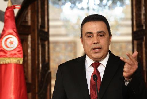 Tunisia's Prime Minister Mehdi Jomaa speaks during a news conference announcing his decision not to run for the upcoming presidential election in Tunis