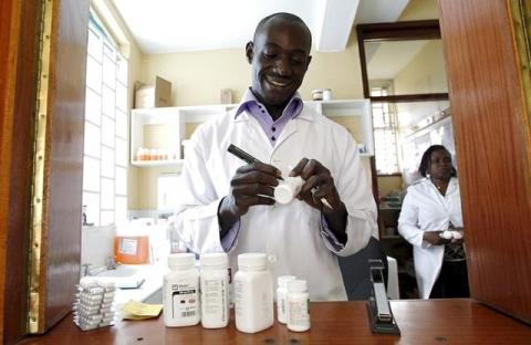 Michael Otieno, a pharmacist, dispenses anti-retroviral (ARV) drugs at the Mater Hospital in Kenya's capital Nairobi, September 10, 2015. PHOTO BY REUTERS/Thomas Mukoya