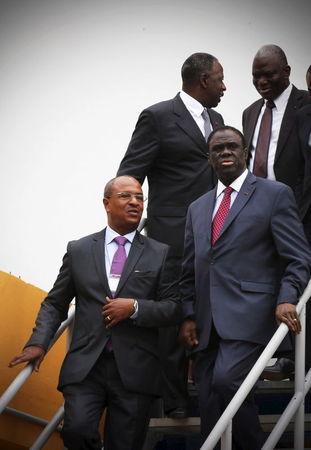 Burkina Faso interim President Michel Kafando (R) arrives with Azito Energie Managing Director Luc Aye (L) for a visit to the Azito power plant in Yopougon, Abidjan, Ivory Coast. PHOTO BY REUTERS/Thierry Gouegnon