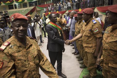 Burkina Faso's President Michel Kafondo (C) greets soldiers after being sworn into his post for the transitional period of one year, in Ouagadougou, November 21, 2014. PHOTO BY REUTERS/Joe Penney