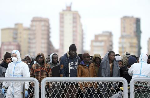 Migrants arrive on the Italian navy ship Orione at Porto Empedocle in Sicily February 17, 2015. Some 640 migrants, rescued by Italian authorities, arrived on the ship. PHOTO BY REUTERS/Alessandro Bianchi