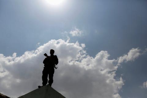 A Houthi militant stands on a wall in Sanaa, Yemen, September 5, 2016. PHOTO BY REUTERS/Khaled Abdullah
