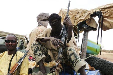 Militiaman from the Ansar Dine Islamic group sit on a vehicle in Gao in northeastern Mali, in a file photo. PHOTO BY REUTERS/Adama Diarra