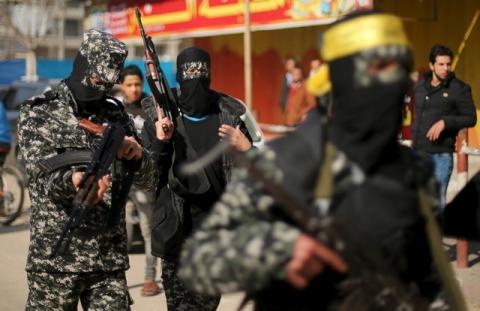 Palestinian militants take part in the funeral of their comrade Mussa Zeater, who was killed in an attack by an Israeli aircraft, in the northern Gaza Strip, January 13, 2016. PHOTO BY REUTERS/Mohammed Salem