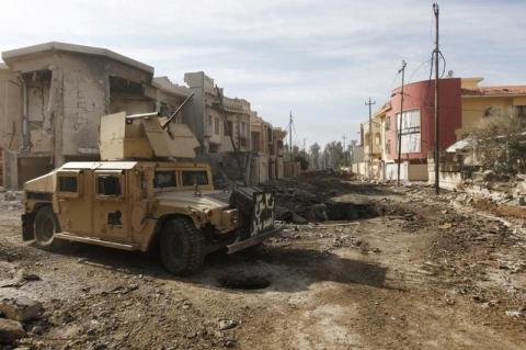 A military vehicle of Iraqi Counter-Terrorism Service (CTS) forces is seen at the site of car bomb attack during a battle with Islamic State militants in Andalus neighborhood of Mosul, Iraq, January 17, 2017. PHOTO BY REUTERS/Alaa Al-Marjani