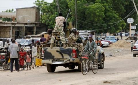 A man cycles past a military truck in Maiduguri, Borno State, Nigeria, August 31, 2016. PHOTO BY REUTERS/Afolabi Sotunde