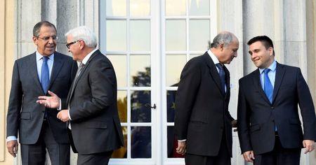 Foreign ministers (L-R) Sergei Lavrov of Russia, Frank-Walter Steinmeier of Germany, Pavlo Klimkin of Ukraine and Laurent Fabius of France arrive for a picture opportunity ahead of their meeting at the German foreign ministry's Villa Borsig at lake Tegel in Berlin, Germany, September 12, 2015. PHOTO BY REUTERS/Tobias Schwarz
