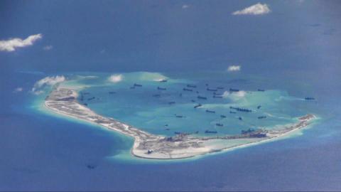Chinese dredging vessels are purportedly seen in the waters around Mischief Reef in the disputed Spratly Islands in the South China Sea, May 21, 2015. PHOTO BY REUTERS/U.S. Navy