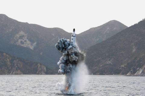 North Korean leader Kim Jong Un guides on the spot the underwater test-fire of strategic submarine ballistic missile. PHOTO BY REUTERS/KCNA