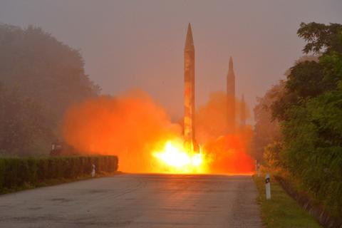 Ballistic rocket is seen launching during a drill by the Hwasong artillery units of the KPA Strategic Force, July 2016. PHOTO BY REUTERS/KCNA