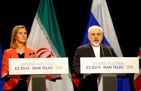 Iranian Foreign Minister Mohammad Javad Zarif addresses during a joint news conference with High Representative of the European Union for Foreign Affairs and Security Policy Federica Mogherini (L) after a plenary session at the United Nations building in Vienna, Austria, July 14, 2015. PHOTO BY REUTERS/Leonhard Foeger