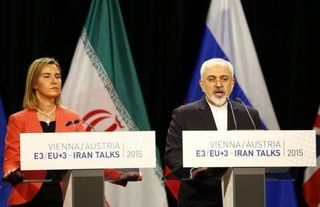 Iranian Foreign Minister Mohammad Javad Zarif addresses during a joint news conference with High Representative of the European Union for Foreign Affairs and Security Policy Federica Mogherini (L) after a plenary session at the United Nations building in Vienna, Austria, July 14, 2015. PHOTO BY REUTERS/Leonhard Foeger