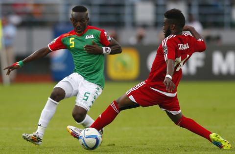 Enrique Senobua of Equatorial Guinea (R) fights for the ball with Burkina Faso's Mohamed Koffi (5) during their Group A soccer match at the African Cup of Nations in Bata, January 21, 2015. PHOTO BY REUTERS/Amr Abdallah Dalsh