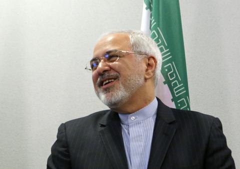 Foreign Minister of Iran Mohammad Javad Zarif reacts during a family photo session at the Caspian Sea littoral states conference in Moscow