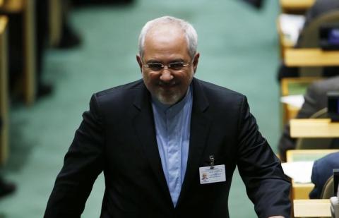 Iranian Foreign Minister Mohammad Javad Zarif walks down an aisle at the 69th United Nations General Assembly at U.N. headquarters in New York