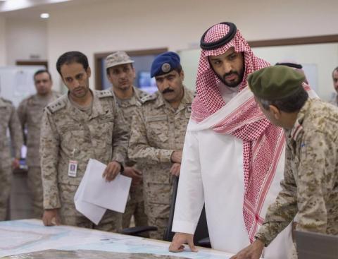 Saudi Defence Minister Prince Mohammad bin Salman is briefed by officers on the military operations in Yemen at the command center in Riyadh, in this March 26, 2015. PHOTO BY REUTERS/Saudi Press Agency