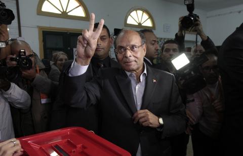 Tunisian President Moncef Marzouki gestures at a polling station during Tunisia's presidential election in Sousse, November 23, 2014. PHOTO BY REUTERS/Anis Mili