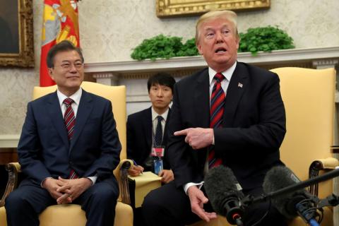U.S. President Donald Trump gestures as he welcomes South Korea's President Moon Jae-In in the Oval Office of the White House in Washington, U.S., May 22, 2018. PHOTO BY REUTERS/Kevin Lamarque
