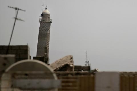 A black jihadist flag hangs from Mosul's Al-Habda minaret at the Grand Mosque, where Islamic State leader Abu Bakr al-Baghdadi declared his caliphate back in 2014, in western Mosul, Iraq, May 29, 2017. PHOTO BY REUTERS/Alkis Konstantinidis