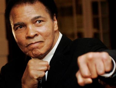 U.S. boxing great Muhammad Ali poses during the Crystal Award ceremony at the World Economic Forum (WEF) in Davos, Switzerland, January 28, 2006. PHOTO BY REUTERS/Andreas Meier