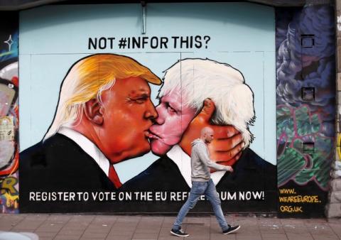 A mural of Donald Trump embracing Boris Johnson is seen on a building in Bristol, Britain May 24, 2016. PHOTO BY REUTERS/Peter Nicholls