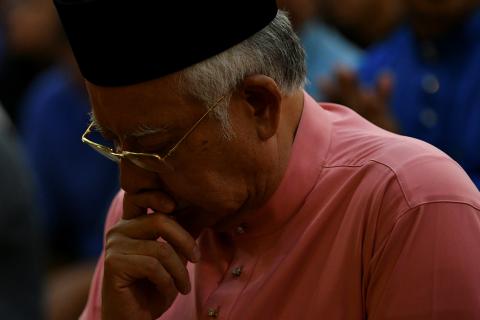 Malaysia’s former Prime Minister Najib Razak prays before he attends the United Malays National Organisation (UMNO) 72th anniversary celebrations in Kuala Lumpur, Malaysia, May 11, 2018. PHOTO BY REUTERS/Stringer