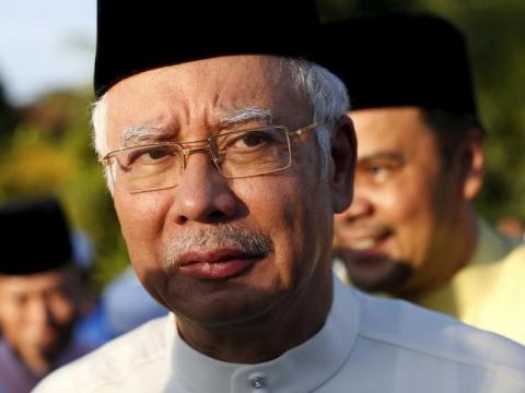 Malaysia's Prime Minister Najib Razak arrives for a news conference at a mosque outside Kuala Lumpur, Malaysia, July 5, 2015. PHOTO BY REUTERS/Olivia Harris