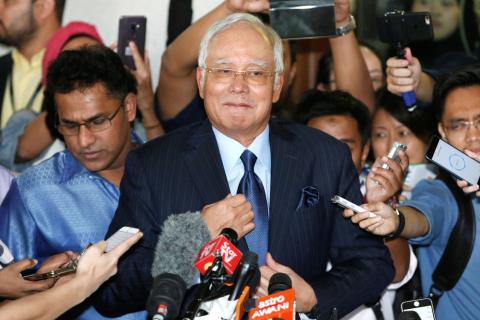 Malaysia's former Prime Minister Najib Razak prepares to speak to journalists as he leaves a court in Kuala Lumpur, Malaysia, September 20, 2018. PHOTO BY REUTERS/Lai Seng Sin