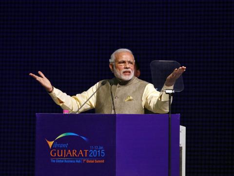 Prime Minister Narendra Modi gestures as he speaks at the Vibrant Gujarat Summit in Gandhinagar in Gujarat, January 11, 2015. PHOTO BY REUTERS/Amit Dave