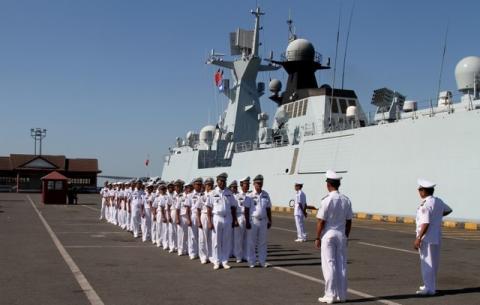 Cambodian navy officials attend a ceremony after conducting an exercise with Chinese naval officers in Preah Sihanouk province, Cambodia, February 26, 2016. PHOTO BY REUTERS/Samrang Pring