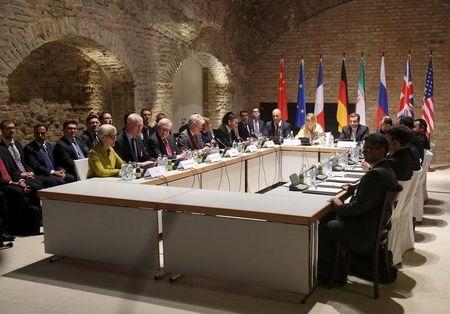 Negotiators of Iran and six world powers face each other at a table in the historic basement of Palais Coburg hotel in Vienna, April 24, 2015. PHOTO BY REUTERS/Heinz-Peter Bader