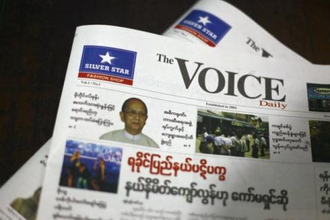 A copy of The Voice Daily newspaper is seen at a press machine house in Yangon April 1, 2013. Since 1963, Myanmar's government has banned private daily newspapers but with effect from April 1, weekly news journals will be allowed to be distributed on a daily basis. PHOTO BY REUTERS/Soe Zeya Tun
