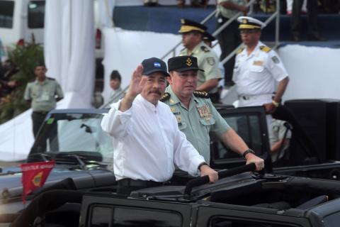 Nicaragua's President Daniel Ortega (L) salutes next to Commander in Chief of the Army of Nicaragua, General Julio Cesar Aviles