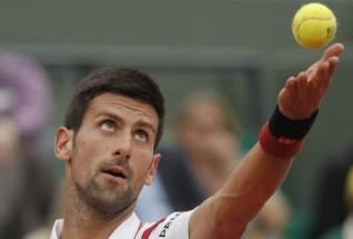 Novak Djokovic of Serbia serves at the French Open in a match against Steve Darcis of Belgium Paris, France, May 26, 2016. PHOTO BY REUTERS/Gonzalo Fuentes