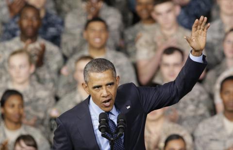 U.S. President Barack Obama waves after delivering a speech at U.S. military base Yongsan Garrison in Seoul, South Korea