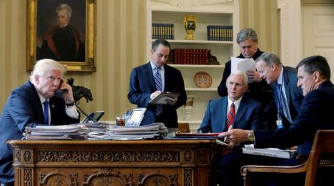 President Donald Trump (L-R), joined by Chief of Staff Reince Priebus, Vice President Mike Pence, senior advisor Steve Bannon, Communications Director Sean Spicer and then National Security Advisor Michael Flynn, speaks by phone with Russia's President Vladimir Putin in the Oval Office. PHOTO BY REUTERS/Jonathan Ernst