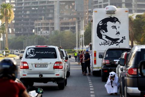 A painting depicting Qatar’s Emir Sheikh Tamim Bin Hamad Al-Thani is seen on a bus during a demonstration in support of him in Doha, Qatar, June 11, 2017. PHOTO BY REUTERS/Naseem Zeitoon