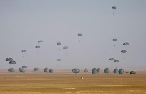 American and Egyptian paratroopers are air-dropped from a C-130 Hercules aircraft during exercise Bright Star 2007, at Kum Oshim 90 km (56 miles) south of Cairo, Egypt, November 8, 2007. PHOTO BY REUTERS/Nasser