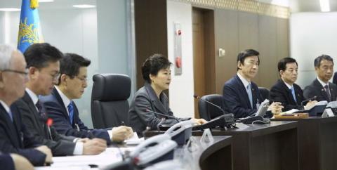 South Korean President Park Geun-hye (C) presides over the National Security Council at the Presidential Blue House in Seoul, South Korea, in this handout picture provided by the Presidential Blue House and released by Yonhap on January 6, 2016. PHOTO BY REUTERS/Yonhap
