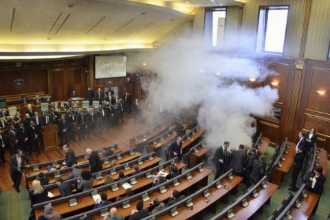 Opposition politicians release tear gas in parliament to obstruct a session in Pristina, Kosovo, February 19, 2016. PHOTO BY REUTERS/Agron Beqiri