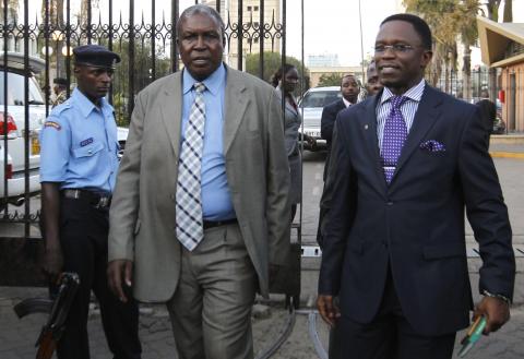 Kenyan members of parliament Silverse Lisamula (L) and Ababu Namwamba (R) leave the National Assembly to protest against the approval of new anti-terrorism laws in Kenya's capital Nairobi, December 18, 2014. PHOTO BY REUTERS/Thomas Mukoya