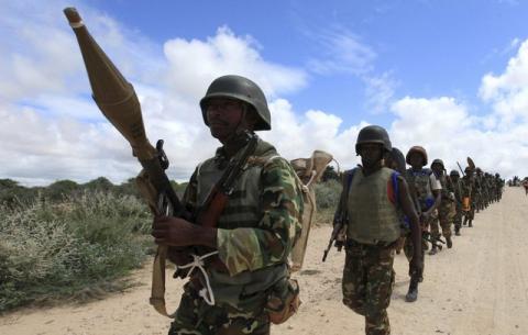 African Union Mission in Somalia (AMISOM) peacekeepers from Burundi patrol after fighting between insurgents and government soldiers erupted on the outskirts of Mogadishu, May 22, 2012. PHOTO BY REUTERS/Feisal Omar