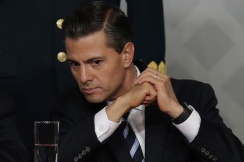 Mexico's President Enrique Pena Nieto looks on during a meeting with lawyers in Mexico City, November 21, 2014. PHOTO BY REUTERS/Tomas Bravo
