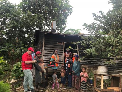 International Federation of Red Cross and Red Crescent Societies members talk to people after an earthquake and aftershocks in Nipa-Kutubu district, Papua New Guinea March 6, 2018. PHOTO BY REUTERS/International Federation of Red Cross and Red Crescent Societies (IFRC)